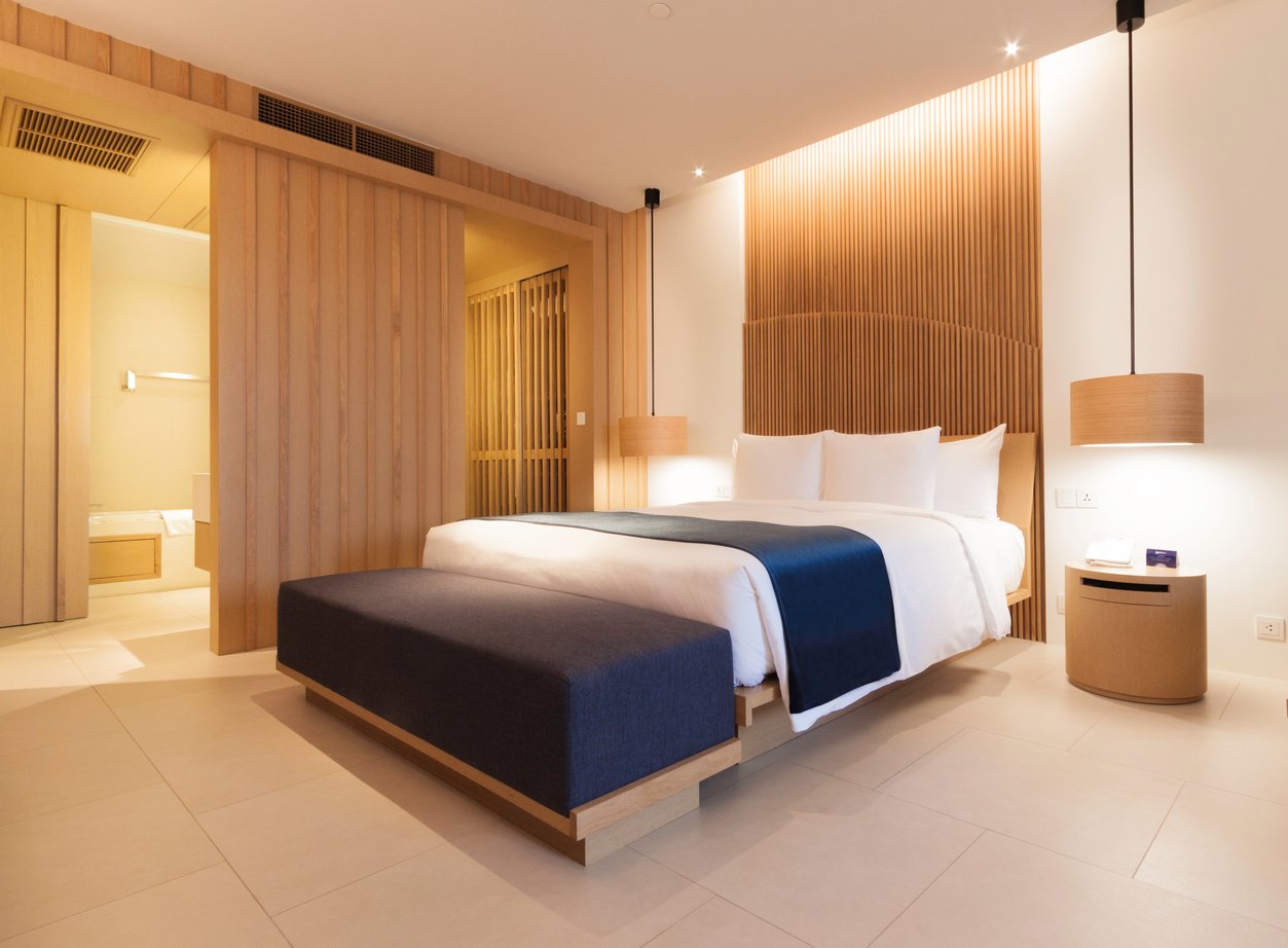 Bed with Illuminated Headboard Beside the Lampshade